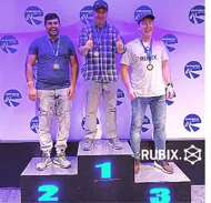 RUBIX team members on a winners' podium at a company sports day