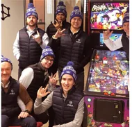 RUBIX team in branded beanies at a social event